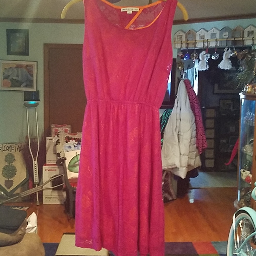 Above the knee pink mesh over bright orange dress